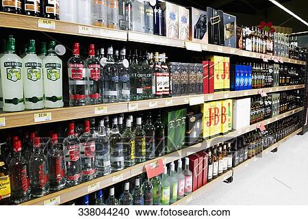 Bottles arranged in a liquor store View Large Photo Image Stock Image - Bottles arranged in a liquor store. Fotosearch