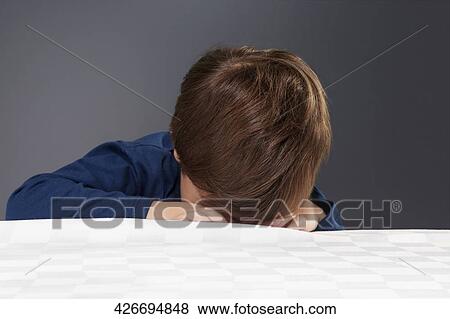 Boy hiding his face View Large Photo Image Stock Photo - Boy hiding his face. Fotosearch