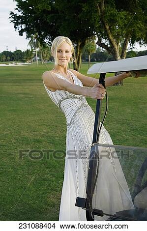 Picture - Bride in a golf cart, Biltmore Golf Course, Coral Gables, Florida, USA. Fotosearch