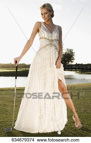 Picture - Bride standing in a golf course, Biltmore Golf Course, Coral Gables, Florida, USA. Fotosearch