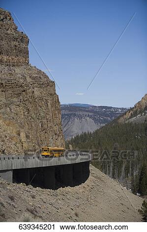 Bus on the road, Yellowstone Lake, Yellowstone National Park, Wyoming, USA View Large Photo Image Stock Image - Bus on the road, Yellowstone Lake, Yellowstone National Park, Wyoming, USA. Fotosearch