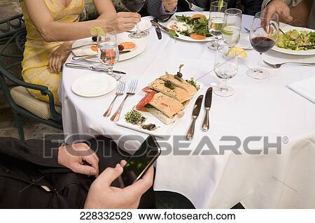 Business executives having lunch in a hotel, Biltmore Hotel, Coral Gables, Florida, USA View Large Photo Image Stock Photo - Business executives having lunch in a hotel, Biltmore Hotel, Coral Gables, Florida, USA. Fotosearch