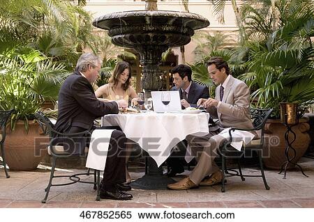 Business executives having lunch in a hotel, Biltmore Hotel, Coral Gables, Florida, USA View Large Photo Image Stock Photography - Business executives having lunch in a hotel, Biltmore Hotel, Coral Gables, Florida, USA. Fotosearch