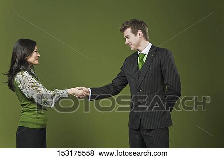 Stock Photo - Business executives shaking hands. Fotosearch