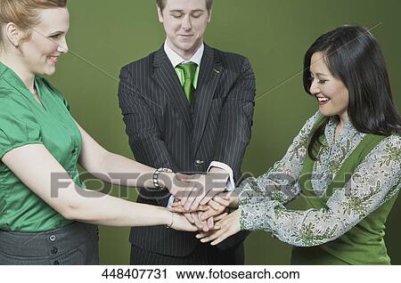 Business executives stacking hands on each other View Large Photo Image Stock Image - Business executives stacking hands on each other. Fotosearch