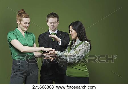 Business executives stacking hands on each other View Large Photo Image Stock Photo - Business executives stacking hands on each other. Fotosearch