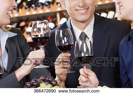 Business executives toasting with wine View Large Photo Image Stock Image - Business executives toasting with wine. Fotosearch
