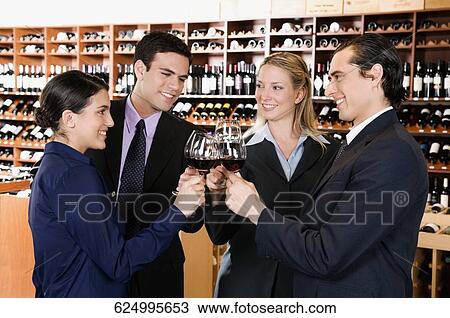 Stock Image - Business executives toasting with wine. Fotosearch