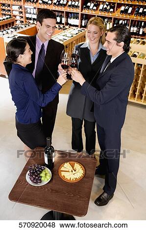 Business executives toasting with wine View Large Photo Image Stock Photo - Business executives toasting with wine. Fotosearch