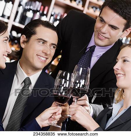 Business executives toasting with wine View Large Photo Image Stock Photography - Business executives toasting with wine. Fotosearch
