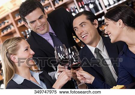 Business executives toasting with wine View Large Photo Image Stock Photography - Business executives toasting with wine. Fotosearch