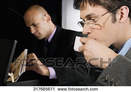 Businessman drinking tea View Large Photo Image Stock Image - Businessman drinking tea. Fotosearch