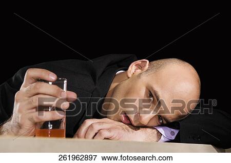 Businessman in a bar View Large Photo Image Stock Photo - Businessman in a bar. Fotosearch