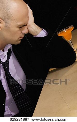 Stock Photo - Businessman in a bar. Fotosearch