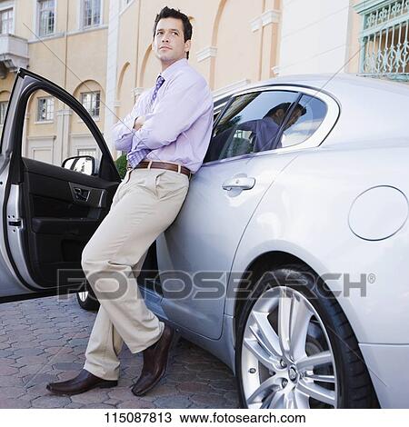 Businessman leaning against a car, Biltmore Hotel, Coral Gables, Florida, USA View Large Photo Image Stock Image - Businessman leaning against a car, Biltmore Hotel, Coral Gables, Florida, USA. Fotosearch