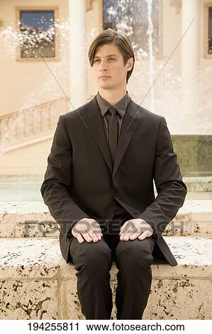 Businessman sitting near a fountain, Biltmore Hotel, Coral Gables, Florida, USA View Large Photo Image Stock Image - Businessman sitting near a fountain, Biltmore Hotel, Coral Gables, Florida, USA. Fotosearch