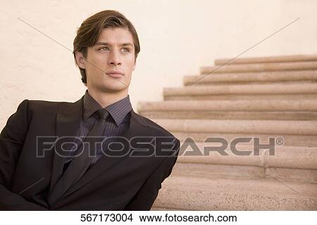 Businessman sitting on a staircase and thinking, Biltmore Hotel, Coral Gables, Florida, USA View Large Photo Image Picture - Businessman sitting on a staircase and thinking, Biltmore Hotel, Coral Gables, Florida, USA. Fotosearch