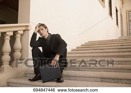 Businessman sitting on a staircase, Biltmore Hotel, Coral Gables, Florida, USA View Large Photo Image Stock Photograph - Businessman sitting on a staircase, Biltmore Hotel, Coral Gables, Florida, USA. Fotosearch