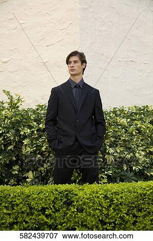 Businessman standing in a formal garden, Biltmore Hotel, Coral Gables, Florida, USA View Large Photo Image Stock Photo - Businessman standing in a formal garden, Biltmore Hotel, Coral Gables, Florida, USA. Fotosearch