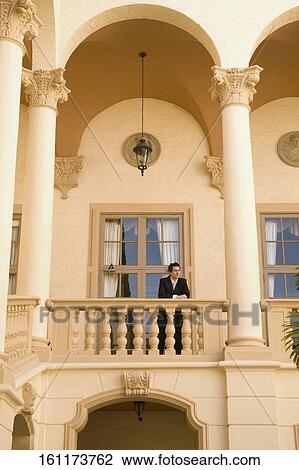 Businessman standing in the balcony, Biltmore Hotel, Coral Gables, Florida, USA View Large Photo Image Stock Image - Businessman standing in the balcony, Biltmore Hotel, Coral Gables, Florida, USA. Fotosearch