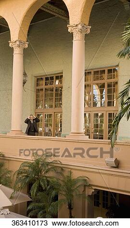 Businessman standing in the balcony, Biltmore Hotel, Coral Gables, Florida, USA View Large Photo Image Stock Image - Businessman standing in the balcony, Biltmore Hotel, Coral Gables, Florida, USA. Fotosearch