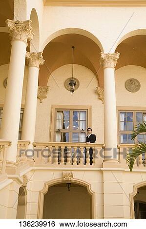 Businessman standing in the balcony, Biltmore Hotel, Coral Gables, Florida, USA View Large Photo Image Stock Photograph - Businessman standing in the balcony, Biltmore Hotel, Coral Gables, Florida, USA. Fotosearch
