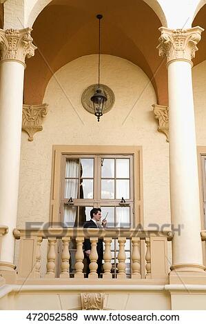 Businessman talking on a walkie-talkie, Biltmore Hotel, Coral Gables, Florida, USA View Large Photo Image Stock Photo - Businessman talking on a walkie-talkie, Biltmore Hotel, Coral Gables, Florida, USA. Fotosearch