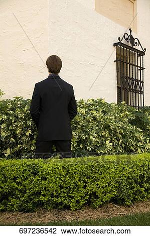 Businessman urinating in a formal garden, Biltmore Hotel, Coral Gables, Florida, USA View Large Photo Image Stock Image - Businessman urinating in a formal garden, Biltmore Hotel, Coral Gables, Florida, USA. Fotosearch