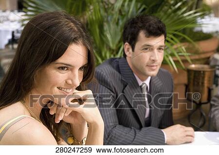 Stock Photo - Businessman with a businesswoman smiling, Biltmore Hotel, Coral Gables, Florida, USA. Fotosearch