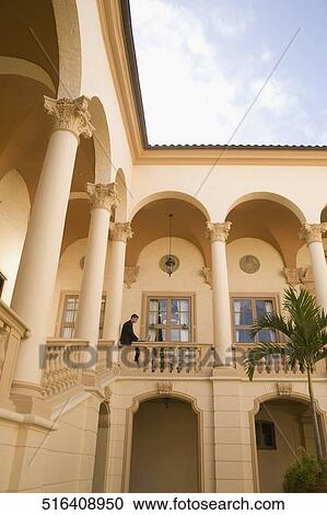 Businessman working on a laptop in the balcony, Biltmore Hotel, Coral Gables, Florida, USA View Large Photo Image Stock Image - Businessman working on a laptop in the balcony, Biltmore Hotel, Coral Gables, Florida, USA. Fotosearch