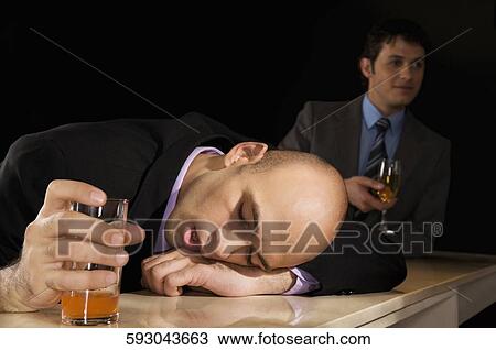 Stock Image - Businessmen in a bar. Fotosearch