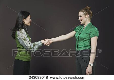 Businesswomen shaking hands View Large Photo Image Stock Photo - Businesswomen shaking hands. Fotosearch