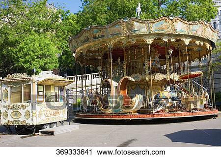 Carousel in an amusement park, Paris, France View Large Photo Image Stock Image - Carousel in an amusement park, Paris, France. Fotosearch