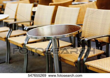 Chairs and a table in a restaurant View Large Photo Image Stock Photo - Chairs and a table in a restaurant. Fotosearch