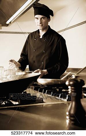 Chef cooking food in the kitchen View Large Photo Image Picture - Chef cooking food in the kitchen. Fotosearch