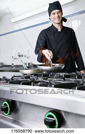 Chef cooking food View Large Photo Image Stock Image - Chef cooking food. Fotosearch