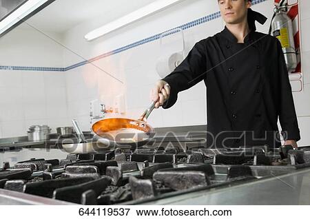 Stock Photo - Chef cooking food. Fotosearch