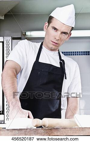 Chef kneading pizza dough View Large Photo Image Stock Photo - Chef kneading pizza dough. Fotosearch