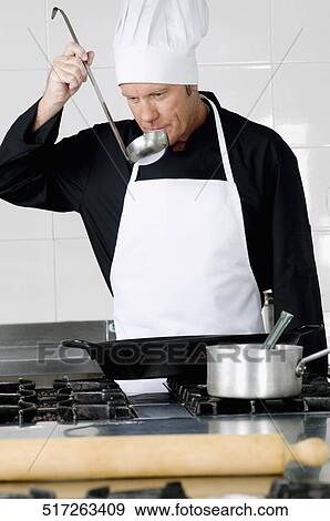 Chef smelling the cooked food View Large Photo Image Stock Photo - Chef smelling the cooked food. Fotosearch