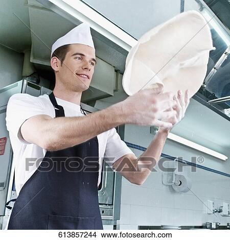 Chef tossing pizza dough View Large Photo Image Picture - Chef tossing pizza dough. Fotosearch