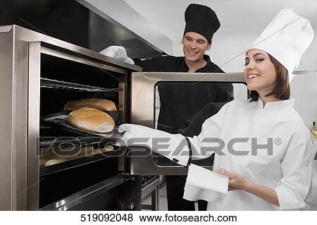Chefs preparing food in the kitchen View Large Photo Image Stock Photo - Chefs preparing food in the kitchen. Fotosearch