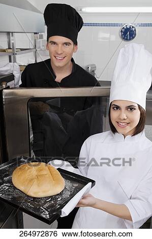 Chefs preparing food in the kitchen View Large Photo Image Stock Photograph - Chefs preparing food in the kitchen. Fotosearch