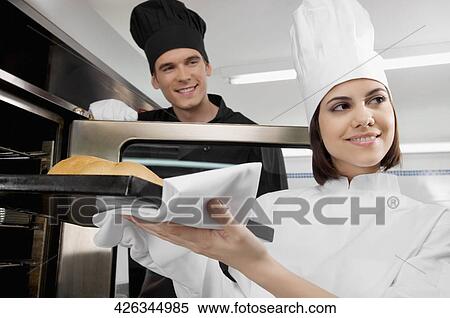 Chefs preparing food in the kitchen View Large Photo Image Stock Photography - Chefs preparing food in the kitchen. Fotosearch