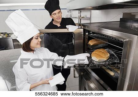 Chefs preparing food in the kitchen View Large Photo Image Stock Photography - Chefs preparing food in the kitchen. Fotosearch