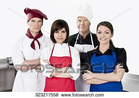 Chefs standing in the kitchen View Large Photo Image Stock Photo - Chefs standing in the kitchen. Fotosearch