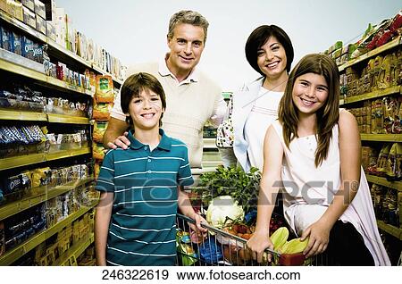 Children with their parents in a supermarket View Large Photo Image Stock Photo - Children with their parents in a supermarket. Fotosearch