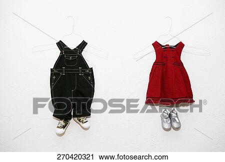 Stock Image - Children's dresses for display at a clothing store. Fotosearch