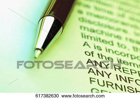 Stock Image - Close-up of a ballpoint pen on a document. Fotosearch