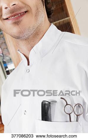 Close-up of a barber smiling View Large Photo Image Stock Image - Close-up of a barber smiling. Fotosearch