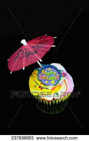 Close-up of a birthday cake with a drink umbrella View Large Photo Image Stock Image - Close-up of a birthday cake with a drink umbrella. Fotosearch